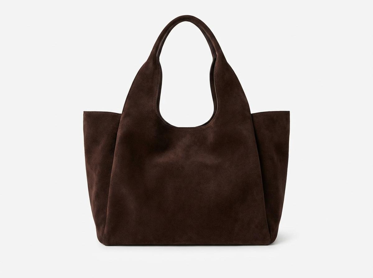 A single The Row Medium Park Tote in dark chocolate suede, White background, Photorealistic high resolution, detailed styling, luxury feel, No grid, no collage, no multiple items, strictly only one single object.